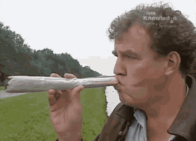 a man blowing a whistle with a bbc knowledge logo on the bottom