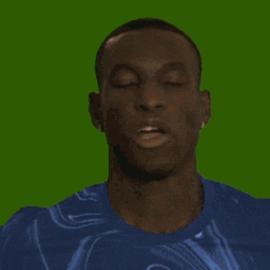 a man in a blue shirt is making a face
