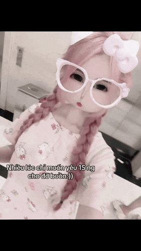 a girl with pink hair is wearing glasses and a hello kitty outfit