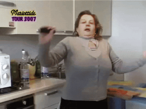 a woman dancing in a kitchen with the words mariottide tour 2007 on the bottom
