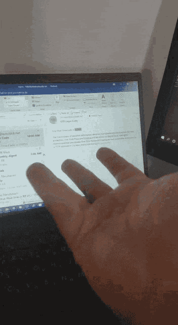 a person 's hand is pressing a button on a computer screen