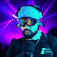 a man with a beard wearing headphones and goggles
