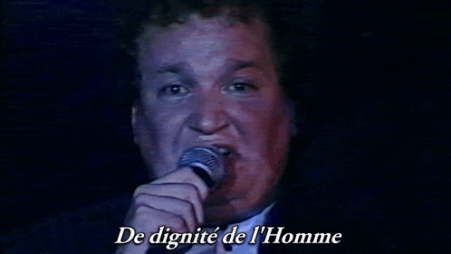 a man singing into a microphone with the words " de dignite de l' homme " below him