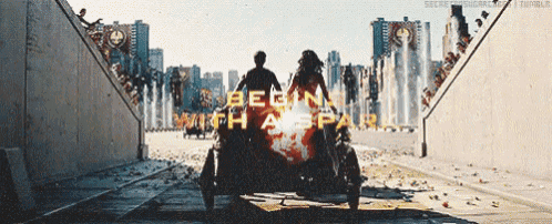 a man and a woman are riding a motorcycle with the words begin with a spark written on it