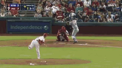 a baseball game is being played in front of an independence bank sign