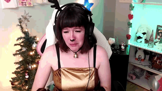 a woman wearing headphones and a bell around her neck