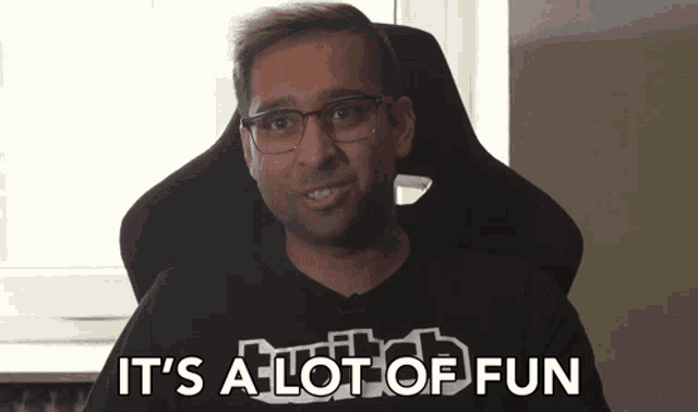 a man sitting in a chair with the words it 's a lot of fun below him