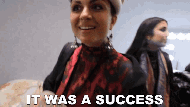 a woman says it was a success in front of a mirror