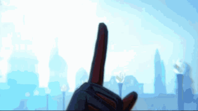 a person 's finger is pointing up in the air