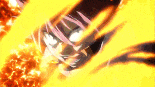 a close up of a person 's face with fire coming out of it