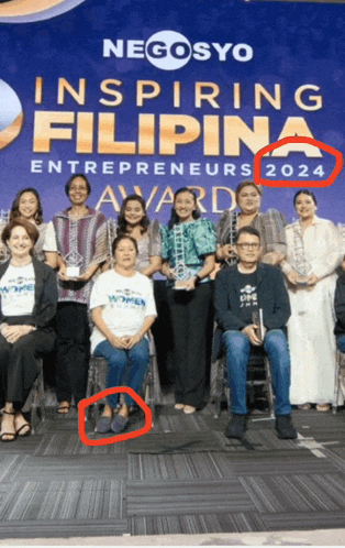 a group of people standing in front of a sign that says inspiring filipina