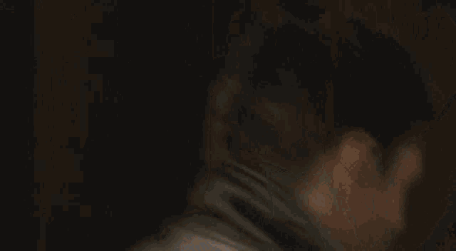 a blurred image of a person holding a lamp .