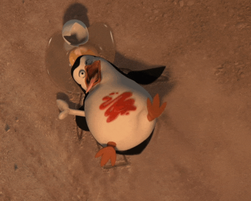 a cartoon penguin is laying on the ground with blood on his body