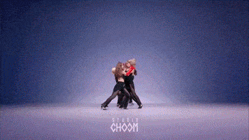 a group of women are dancing in front of a blue background with the word choom on it