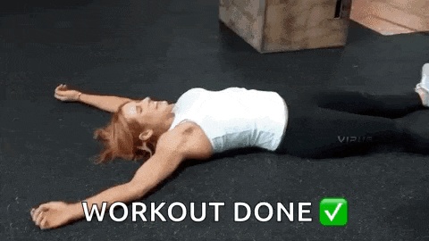 a woman is laying on her stomach on the floor .
