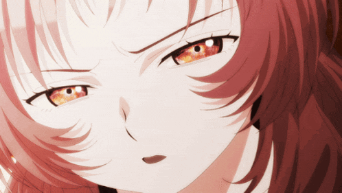 a close up of a person 's face with red hair