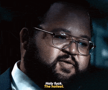 a man with glasses says holy fuck the hottest