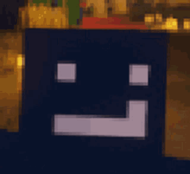 a pixel art drawing of a face with the word togo written in red letters