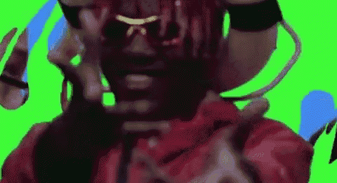 a close up of a person 's face with a green screen behind them .