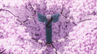 a person in a blue kimono is standing in a field of purple flowers