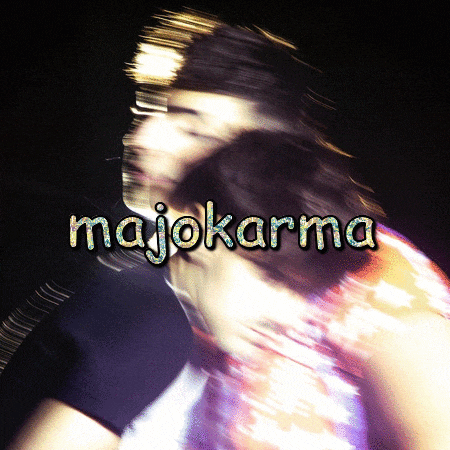 a blurry photo of a man and woman with the words majokarma written on it