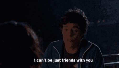 a man talking to a woman with the words i can 't be just friends with you below him