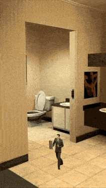a man in a suit walks through a bathroom with a toilet and sink