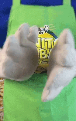 a close up of a cartoon character 's hands on a bag of jiffy bag