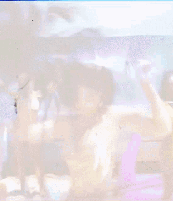 a woman in a white dress is dancing with a pink ribbon