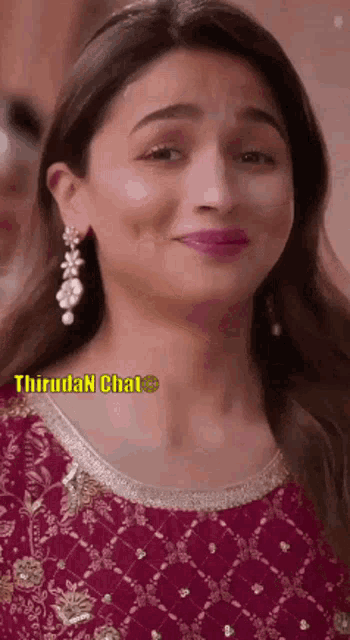 a close up of a woman 's face with a caption that says thirudan chat .