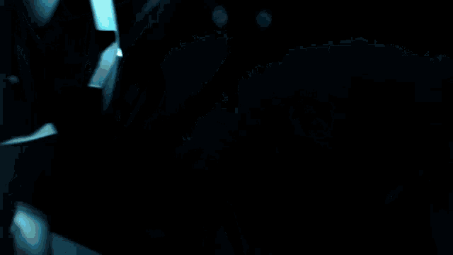 a blurred image of a person in the dark