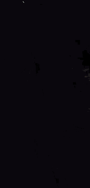 a blurry photo of a man and a woman in a dark room