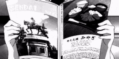 a person is holding a book with a picture of a man riding a horse on the cover .