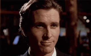 a man in a suit and tie is smiling .
