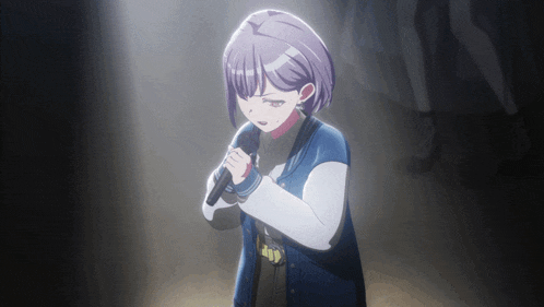 a girl with purple hair is singing into a microphone in a dark room