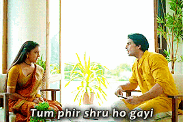 a man in a yellow shirt sits next to a woman in a saree and says tum phir shru ho gayi
