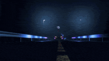 a car is driving down a road at night
