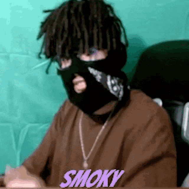 a man wearing a mask and a necklace says smoky in purple letters