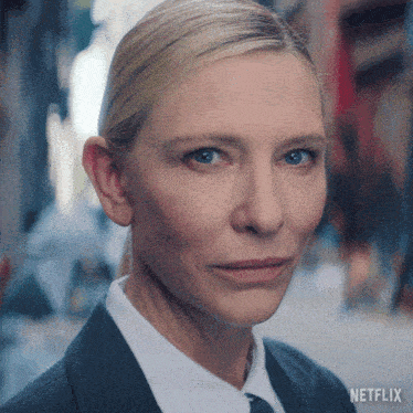 a close up of a woman 's face with netflix on the bottom right