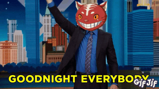 a man in a suit and tie with a red cat head says goodnight everybody