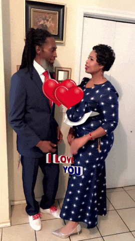 a man in a suit and a woman in a blue dress are standing next to each other with the words i love you above them