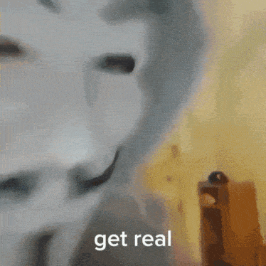 a blurry picture of a room with the words " get real " on the bottom