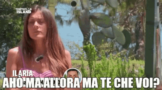 a woman in a bikini is talking to a man in a temptation island video