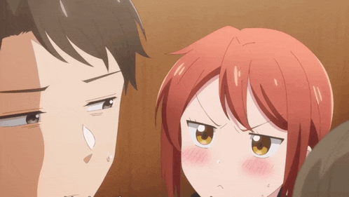 a man and a girl are looking at each other and the girl is making an angry face