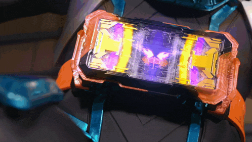 a close up of a toy with a purple and yellow display