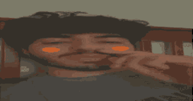 a man with a beard is laying on a bed with his eyes closed and his hand on his nose