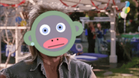a man with a green monkey mask on his face