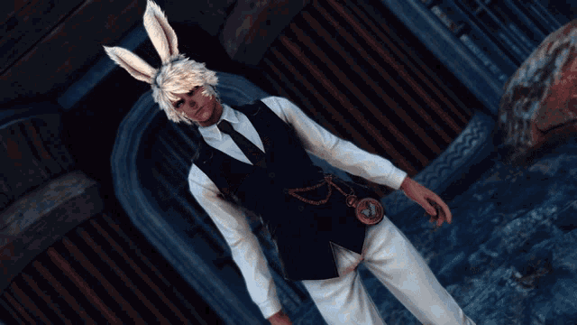 a man wearing bunny ears and a black vest is standing in front of a building