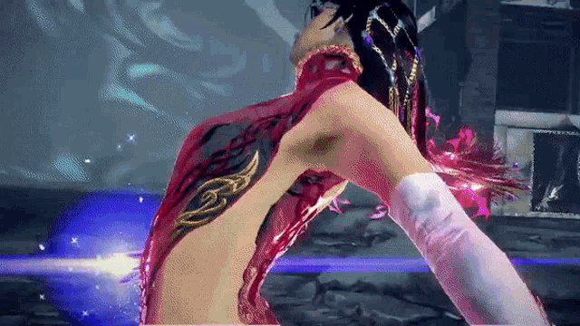 a woman with a tattoo on her back is dancing