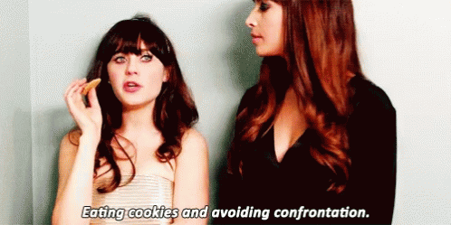 Eating Cookies Avoiding Confrontation GIF - Eating Cookies Avoiding Confrontation Zooey Deschanel GIFs